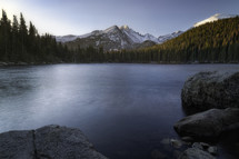 soft morning light illuminates Bear Lake and Longs Peak in Rocky Mountain National Park located in Estes Park Colorado