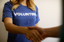 volunteer shaking hands