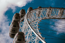 London Eye tourist attraction, capital city, England travel and tourism ferris wheel.