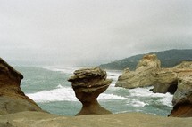 weathered and eroded rock formations on a shore 