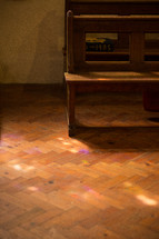 church pews and herringbone wood floors 