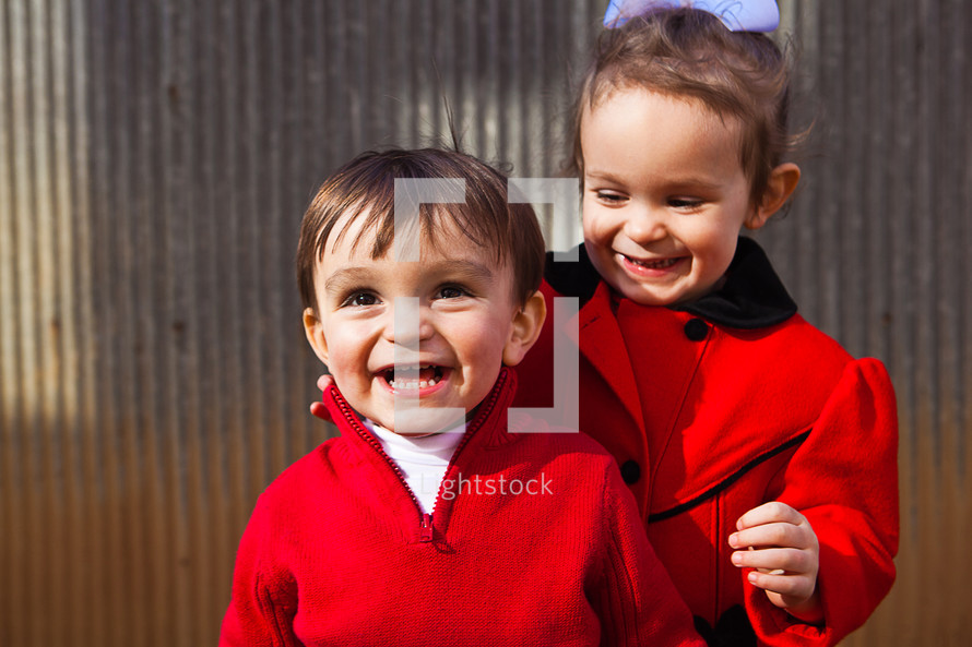 A little boy and girl laughing