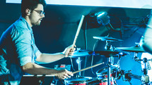 man playing the drums 