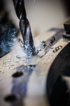 drill bit press steel metal shavings holes smoke