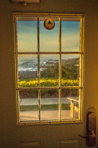 view of the ocean out a door window 
