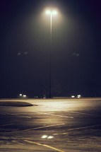 street lamp over a parking lot 
