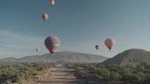 Hot Air Balloon Flying Above Pyramids of San Juan Teotihuacan Mexico Sunrise Ride