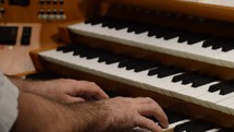 man playing an organ 