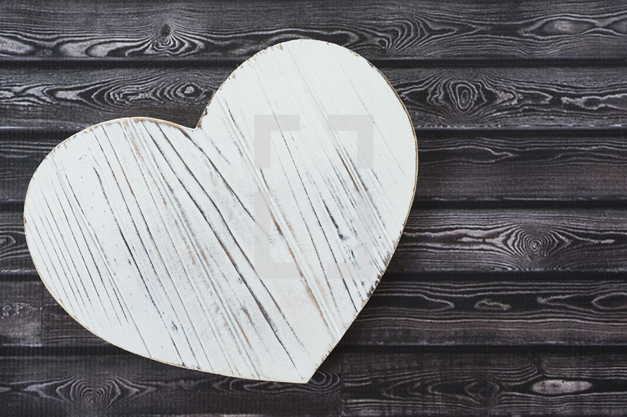 wood heart shape on wood background 