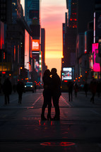 A couple kissing at sunset time in the middle of the road