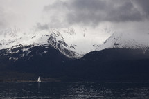 sailboat and snow capped mountain view 