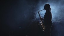 a person playing a saxophone 