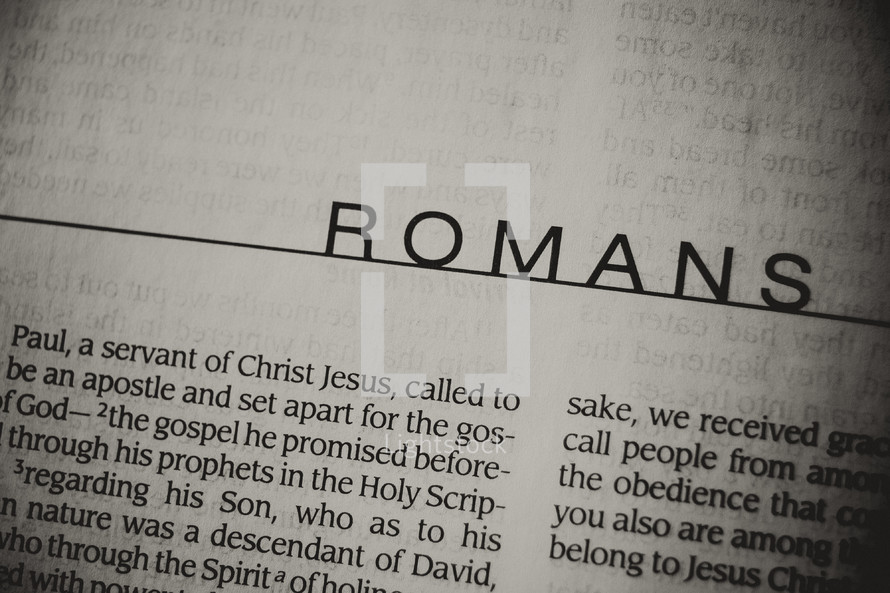 A close up of the book of Romans