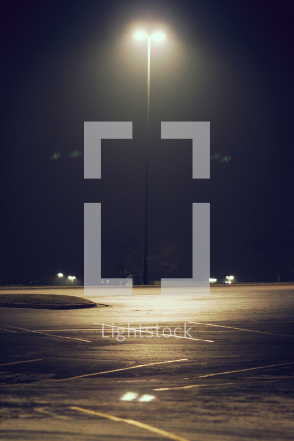 street lamp over a parking lot 