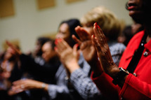 Clapping hands at a worship service.