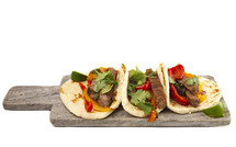 Beef Fajitas with Bell Peppers on a white background 