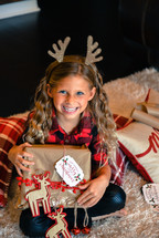 girl child with reindeer antlers 