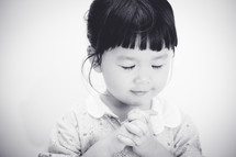 a praying little girl 
