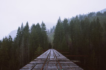 train tracks on a rustic bridge 