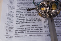 Sword on pages of Bible open to Ephesians 6.