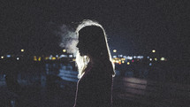dark, darkness, woman, side profile, standing, outdoors, smoke, night 