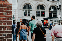 pedestrians on a busy city sidewalk 