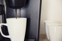 coffee pouring into a mug 