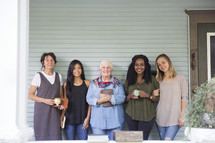 women standing together on a porch before a Bible study 