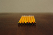 row of unsharpened pencils 