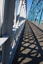 shadows from bridge railings 