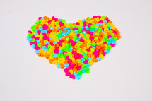 colorful heart shaped candy in the shape of a heart 