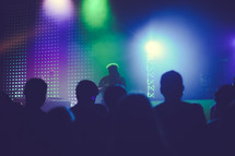 silhouettes of people at a concert 