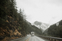traffic on a wet mountain highway 