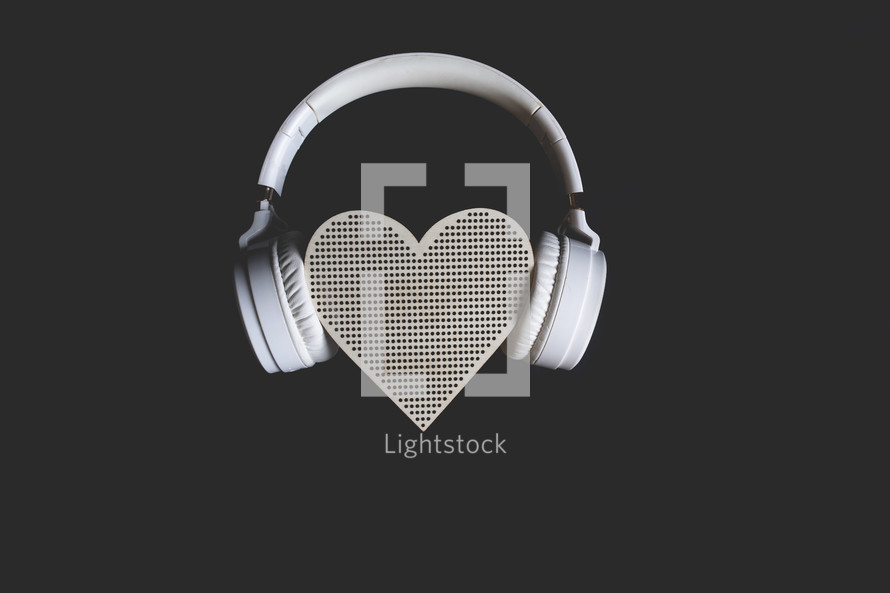 headphones on a heart shaped speaker 