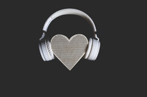 headphones on a heart shaped speaker 