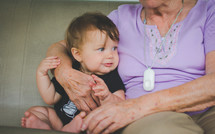 a grandmother sitting with her baby grandson 
