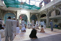 Muslim men in prayer in a mosque 
