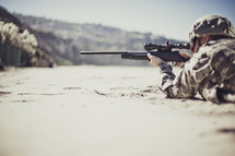 Soldier pointing a gun