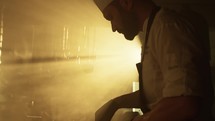 Sunrise lights lighting up the beauty of a Chef working 