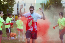 teens tossing colors at a color run