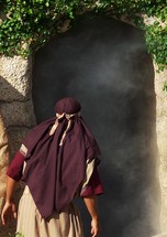A Disciple of Jesus Christ peers into the empty tomb of Jesus Christ after discovering the stone rolled away and the tomb left open after Jesus was crucified and buried. This beautiful image of hope signifies the resurrection of Jesus. He arose from the dead just as He said He would, overcoming death, hell and the grave .  