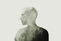 side profile of a man with forest overlay 