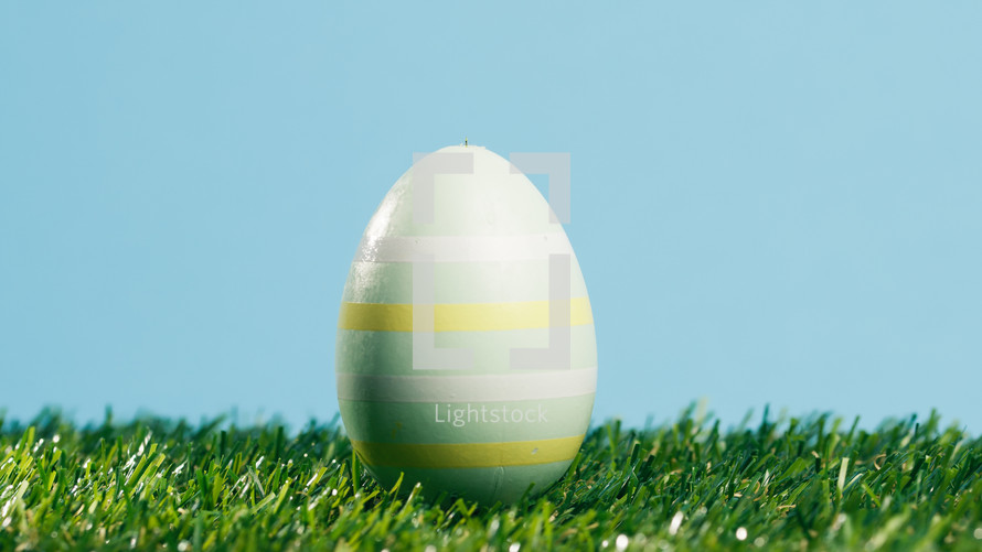 Painted Easter Egg On Blue Background