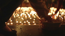 lighting prayer candles