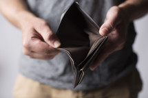 man holding an empty wallet