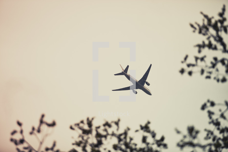 An airplane flies through the sky