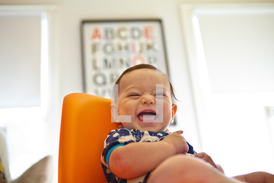 Toddler boy laughing