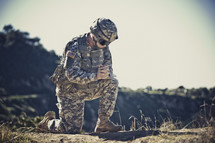 soldier kneeling in prayer