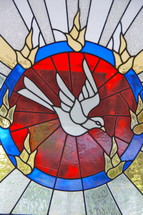 Stained church glass window - Holy Spirit dove - Baptism of Holy Spirit