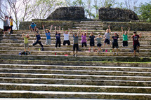 children jumping up celebrating on steps 